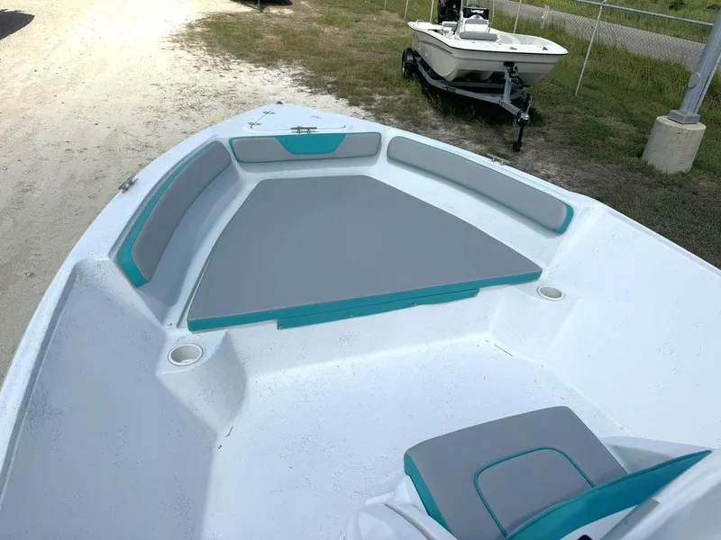 Slide: The Image of 2023 K2 Powerboats 22CRS with gray and turquoise seating. - 11