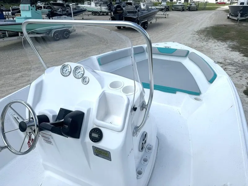 Slide: The Image of 2023 K2 Powerboats 22CRS with helm and seating area. - 14