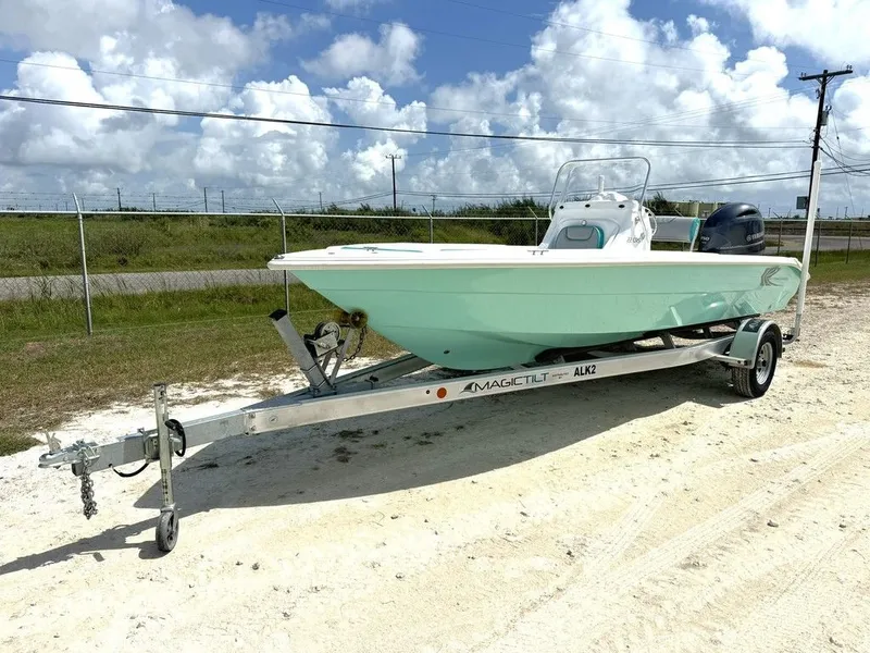 Slide: The Image of 2023 K2 Powerboats 22CRS on trailer, light green, outdoors. - 3