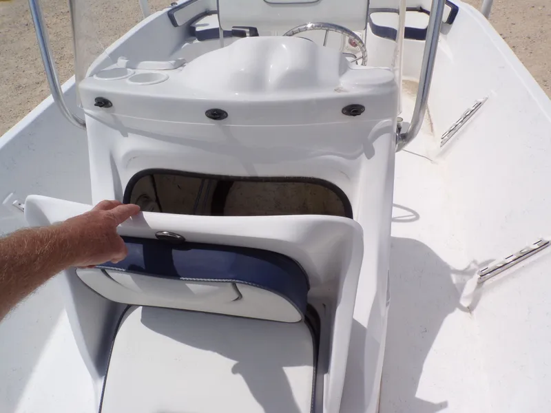 Slide: The Image of 2023 K2 Powerboats 22CRS with open seat storage compartment. - 13