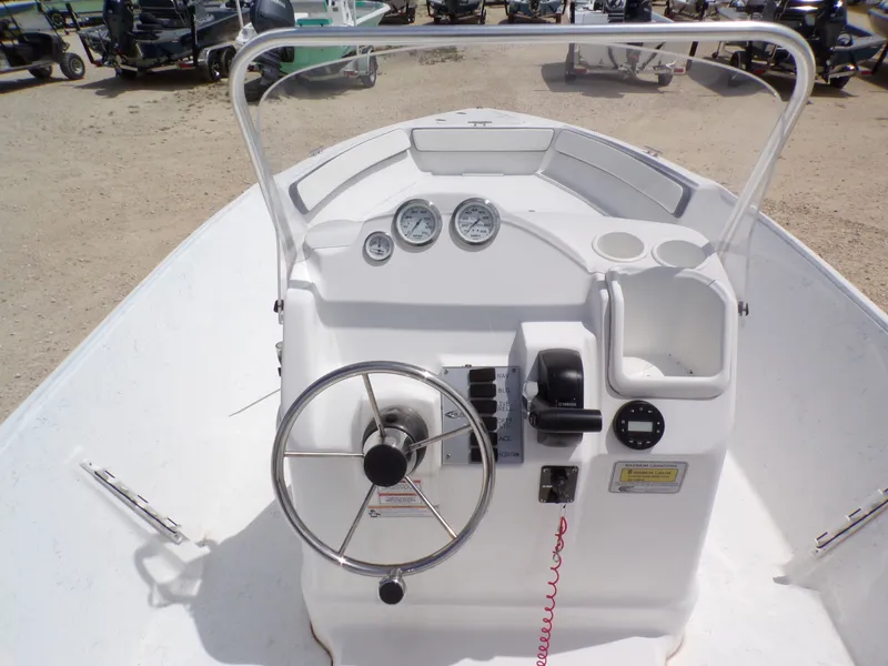 Slide: The Image of 2023 K2 Powerboats 22CRS helm with steering wheel and gauges. - 15