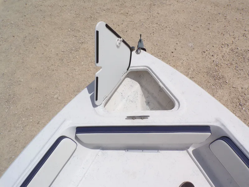 Slide: The Image of Bow area of 2023 K2 Powerboats 22CRS with open storage compartment. - 22