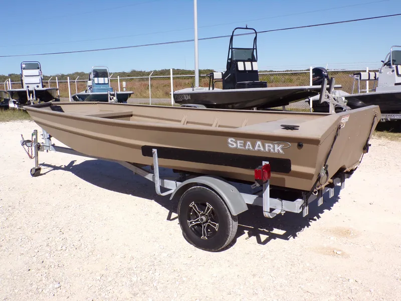 Slide: The Image of 2023 SeaArk 1652 MVT boat on trailer outdoors. - 11