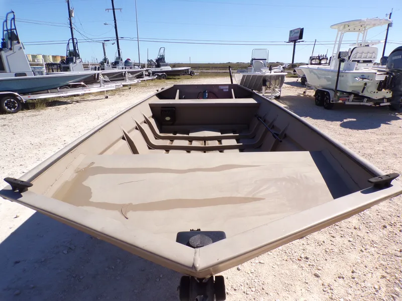 Slide: The Image of 2023 SeaArk 1652 MVT aluminum boat on a parking lot. - 12