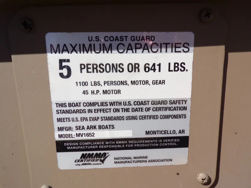 Slide: The Image of USCG capacity label for SeaArk 1652 MVT, 5 persons or 641 lbs. - 18