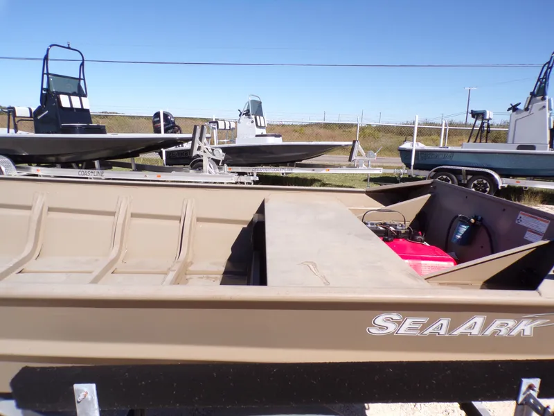 Slide: The Image of 2023 SeaArk 1652 MVT boat on a trailer outdoors. - 24