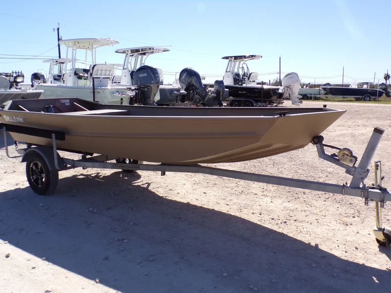 Slide: The Image of 2023 SeaArk 1652 MVT boat on trailer outdoors. - 6