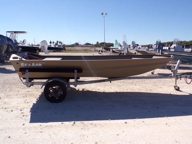 Slide: The Image of 2023 SeaArk 1652 MVT boat on trailer outdoors. - 7