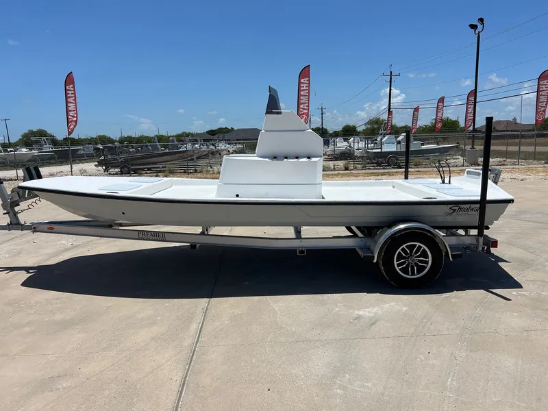 The Image of 2026 Shoalwater 19' Catamaran on trailer outdoors. - 1