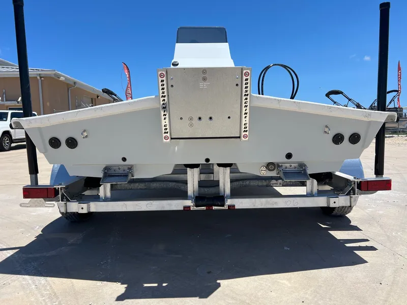 Slide: The Image of Rear view of a 2026 Shoalwater 19' Catamaran on a trailer. - 11