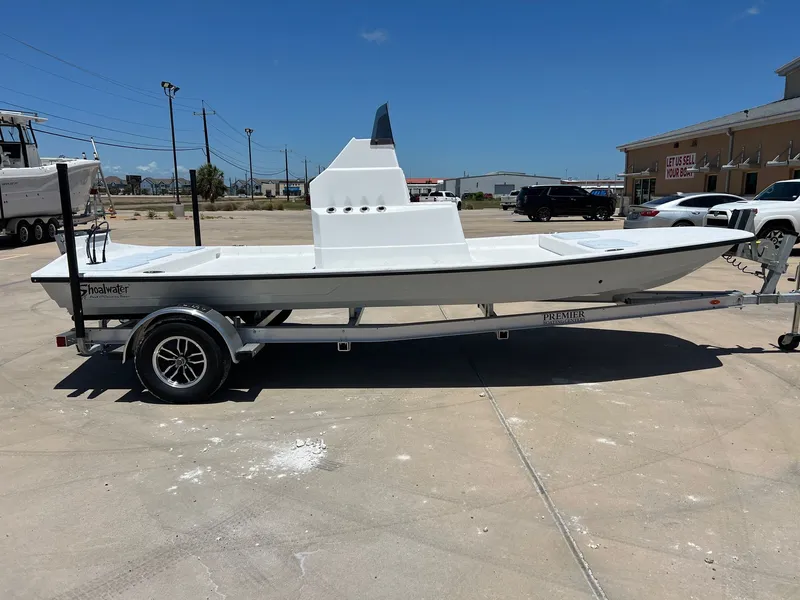 Slide: The Image of 2026 Shoalwater 19' Catamaran parked on trailer outdoors. - 8