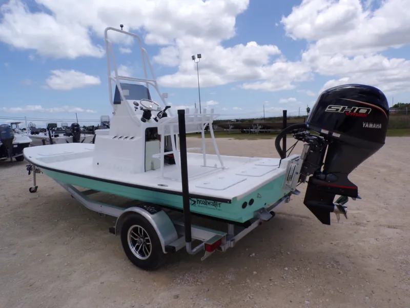 Slide: The Image of 2026 Shoalwater 19' Catamaran with Yamaha engine on trailer. - 12