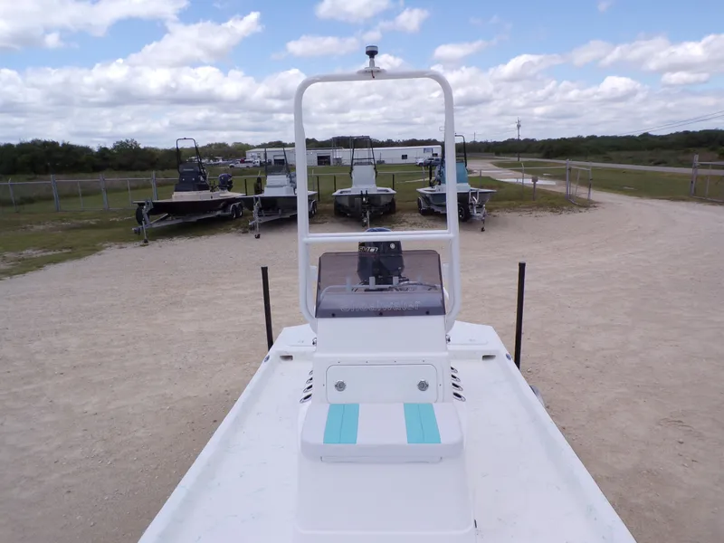Slide: The Image of 2026 Shoalwater 19' Catamaran parked on a gravel path. - 13