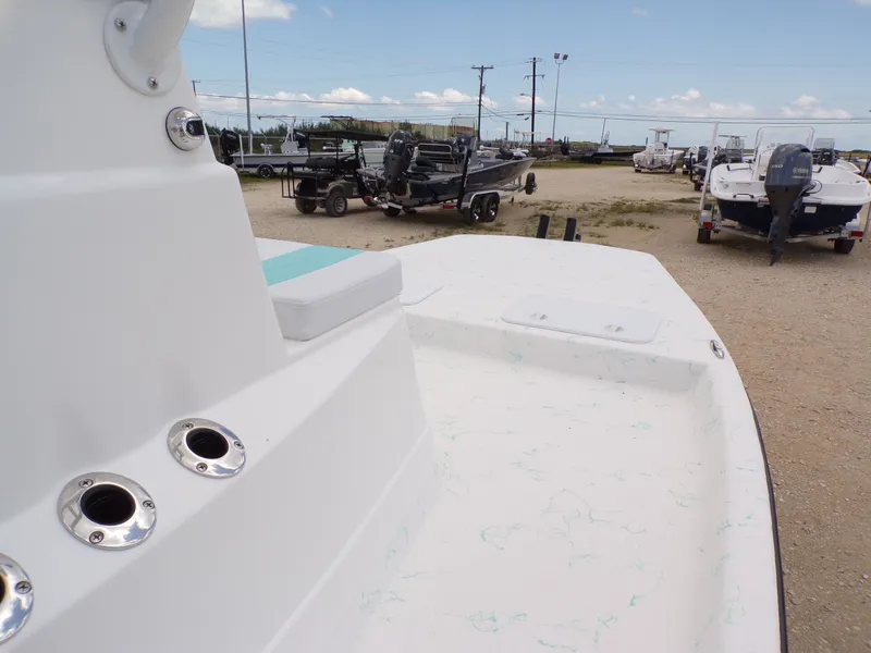 Slide: The Image of 2026 Shoalwater 19' Catamaran parked at a boat lot. - 16