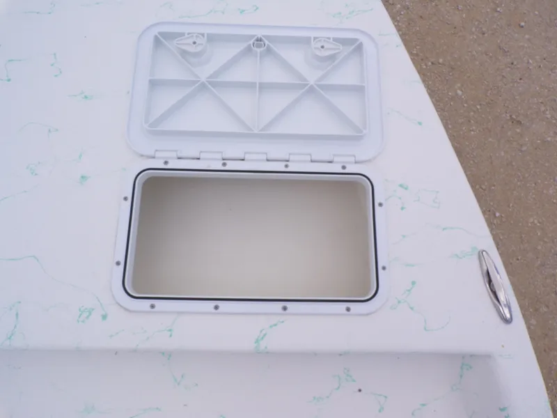 Slide: The Image of Open storage compartment on a 2026 Shoalwater 19' Catamaran. - 22