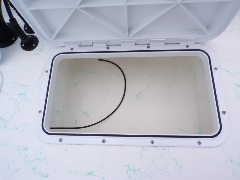 Slide: The Image of Open storage compartment on Shoalwater 19' Catamaran 2026. - 25