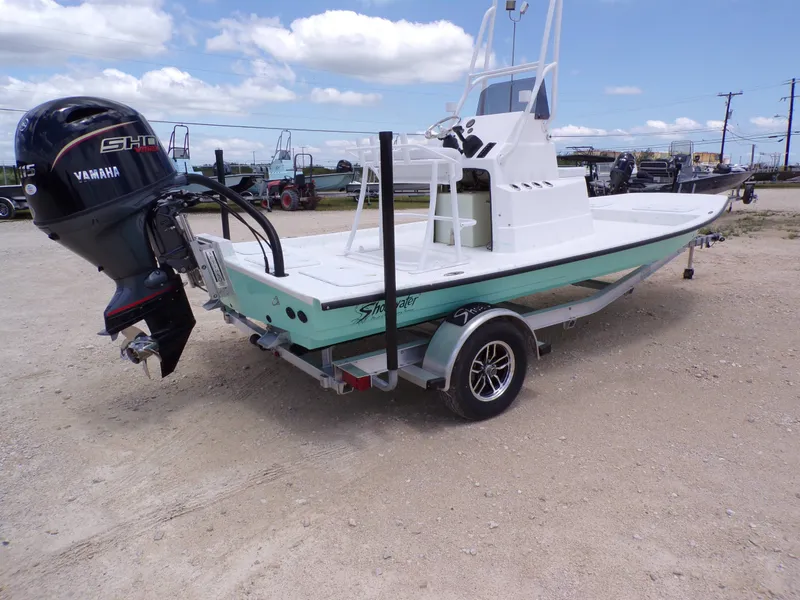 Slide: The Image of 2026 Shoalwater 19' Catamaran with Yamaha engine on trailer. - 9
