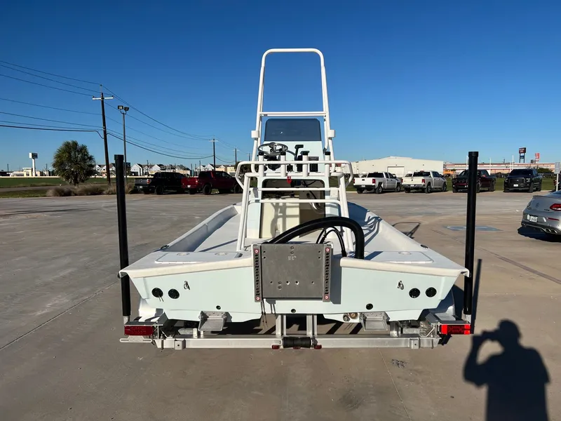Slide: The Image of Rear view of a 2026 Shoalwater 19' Catamaran on a parking lot. - 10