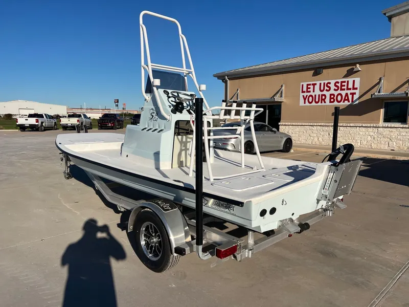 Slide: The Image of 2026 Shoalwater 19' Catamaran on trailer outside sales building. - 11