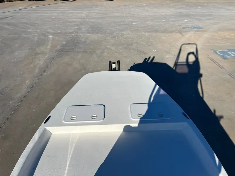 Slide: The Image of 2026 Shoalwater 19' Catamaran on a parking lot. - 12