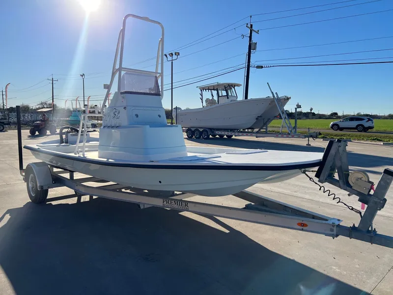 Slide: The Image of Shoalwater 19' Catamaran 2026 on trailer under sunny sky. - 6