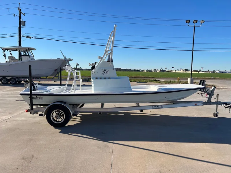 Slide: The Image of 2026 Shoalwater 19' Catamaran on trailer outdoors. - 8