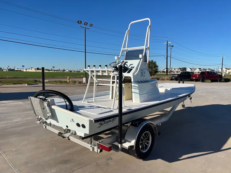 Slide: The Image of 2026 Shoalwater 19' Catamaran on trailer outdoors. - 9