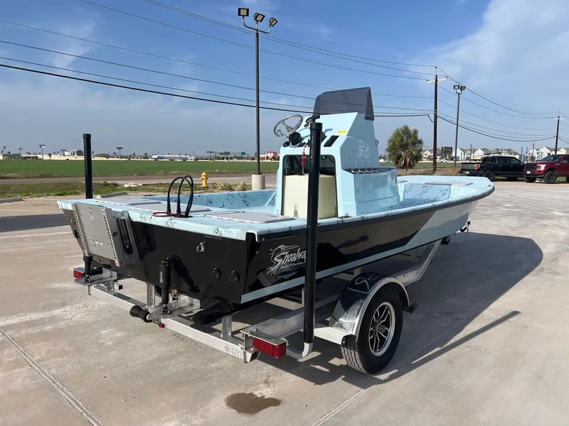 Slide: The Image of 2026 Shoalwater 20' Catamaran on trailer, blue sky. - 11