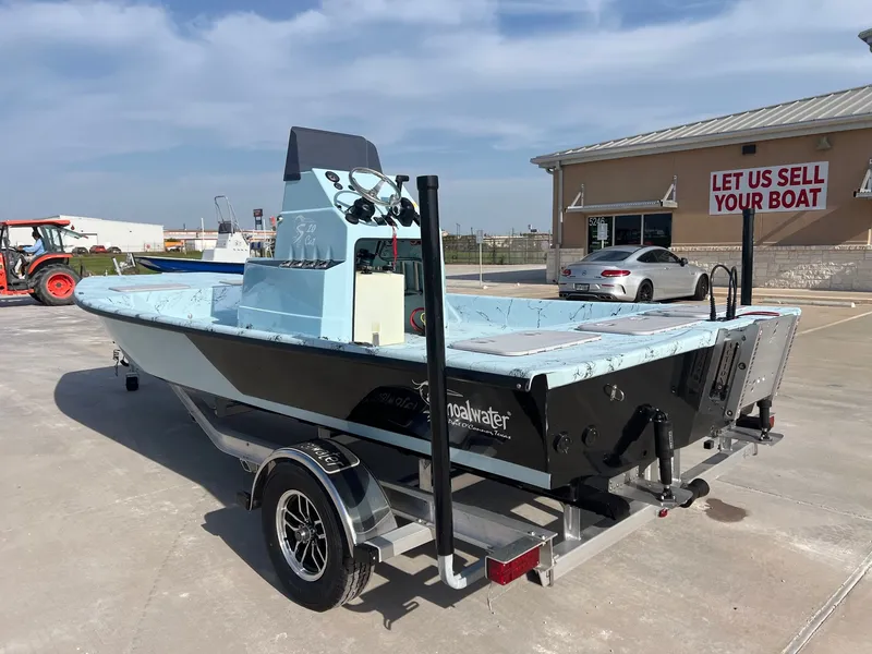 Slide: The Image of 2026 Shoalwater 20' Catamaran on trailer outside sales building. - 13