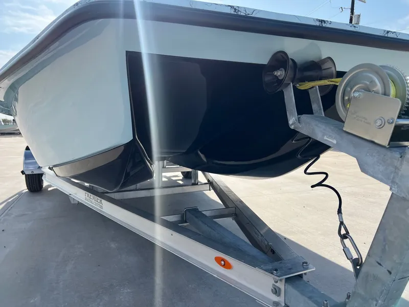 Slide: The Image of 2026 Shoalwater 20' Catamaran on trailer, close-up of hull. - 7
