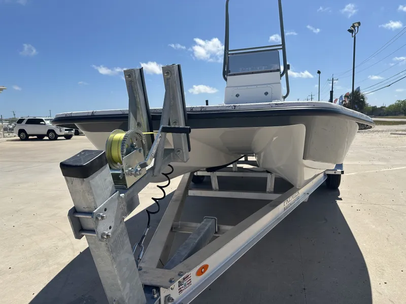 The Image of 2026 Shoalwater 21' Catamaran on trailer under sunny skies. - 1