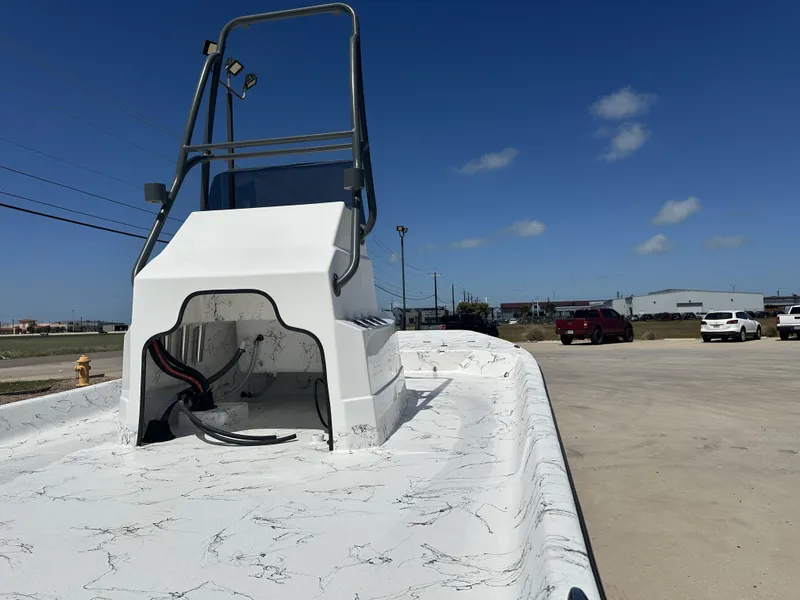 Slide: The Image of 2026 Shoalwater 21' Catamaran on a parking lot under sunny skies. - 11