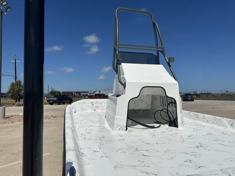 Slide: The Image of 2026 Shoalwater 21' Catamaran on parking lot under sunny skies. - 12