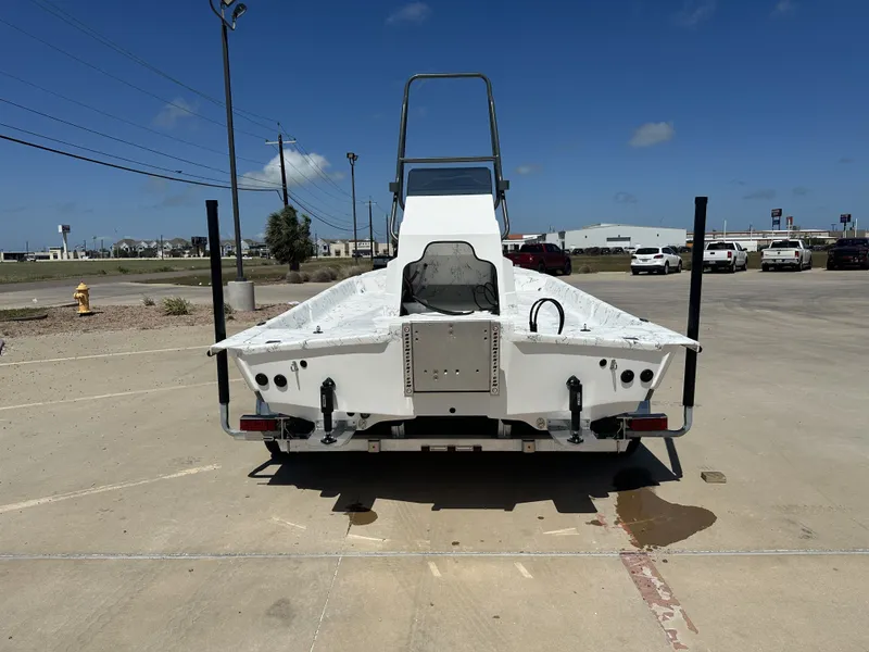 Slide: The Image of Rear view of a Shoalwater 21' Catamaran, 2026 model, on a parking lot. - 17