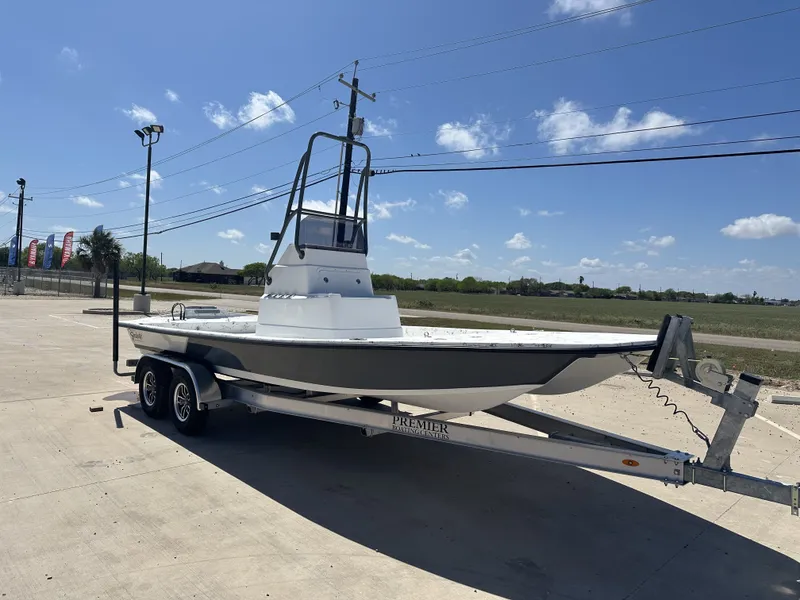 Slide: The Image of 2026 Shoalwater 21' Catamaran on trailer under sunny skies. - 3