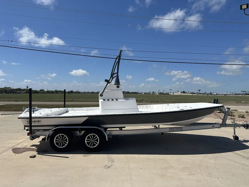Slide: The Image of Shoalwater 21' Catamaran 2026 on trailer under blue sky. - 5