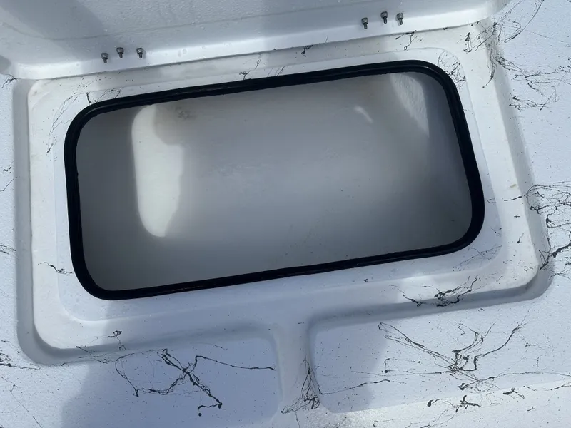 Slide: The Image of Open storage compartment on a 2026 Shoalwater 21' Catamaran. - 7