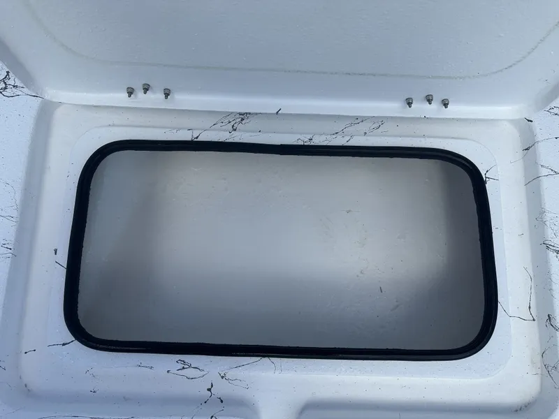Slide: The Image of Open storage compartment on a 2026 Shoalwater 21' Catamaran. - 8