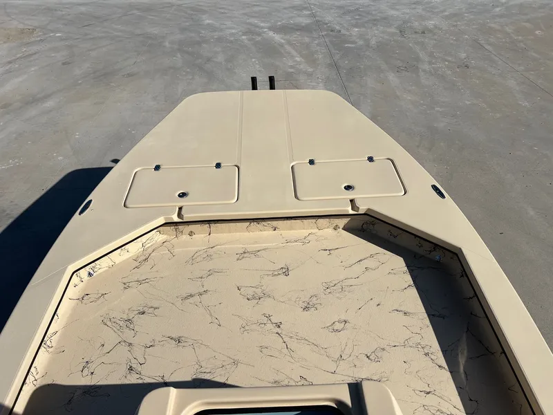 Slide: The Image of Deck of a 2026 Shoalwater 23' Catamaran with storage compartments. - 12