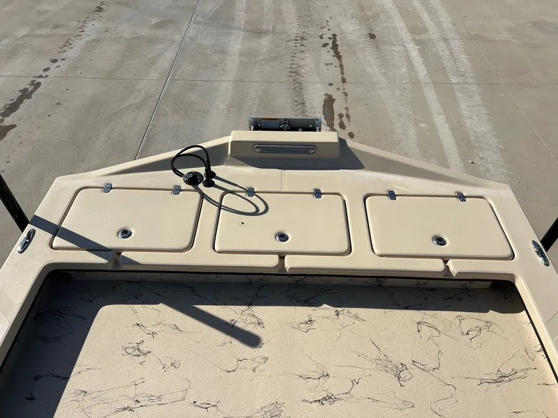 Slide: The Image of Deck of a 2026 Shoalwater 23' Catamaran with storage compartments. - 15