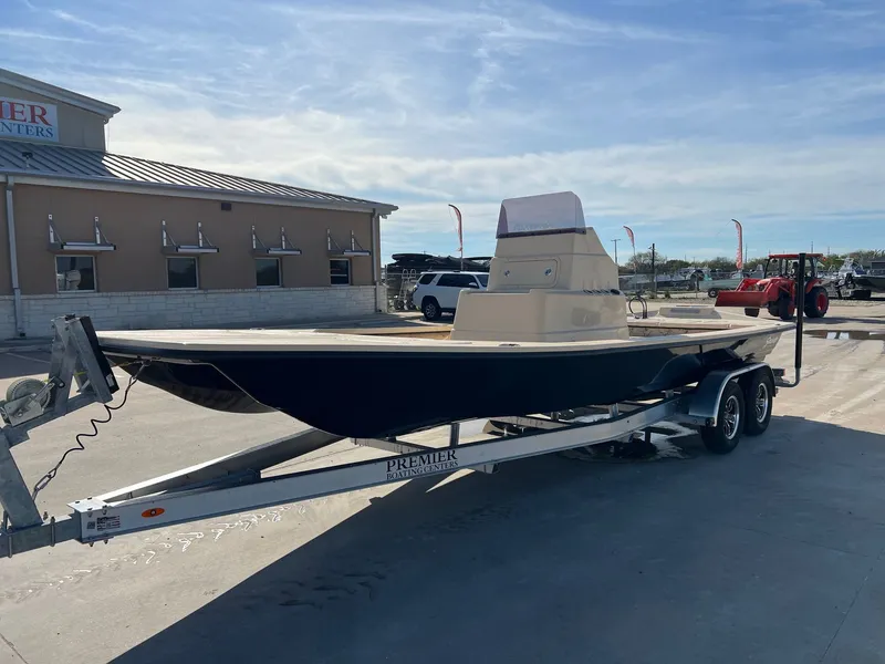 Slide: The Image of 2026 Shoalwater 23' Catamaran on trailer in front of building. - 3
