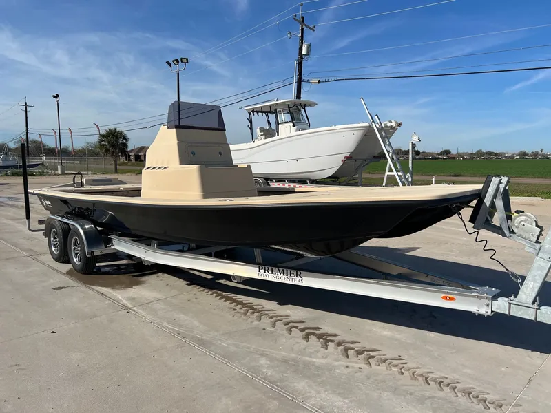 Slide: The Image of 2026 Shoalwater 23' Catamaran on trailer outdoors. - 6