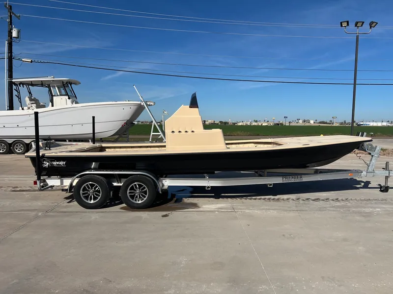 Slide: The Image of 2026 Shoalwater 23' Catamaran on trailer under sunny sky. - 7