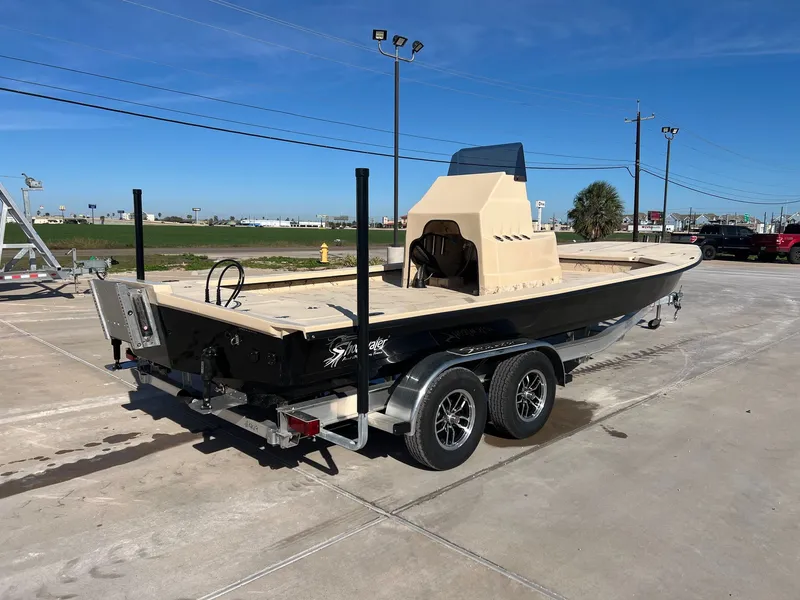 Slide: The Image of 2026 Shoalwater 23' Catamaran parked outdoors on trailer. - 9