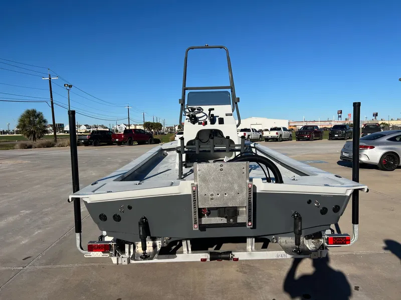Slide: The Image of Rear view of a 2026 Shoalwater 23' Catamaran on a parking lot. - 10