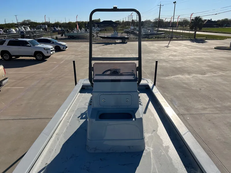 Slide: The Image of Shoalwater 23' Catamaran 2026 on parking lot under sunny sky. - 13