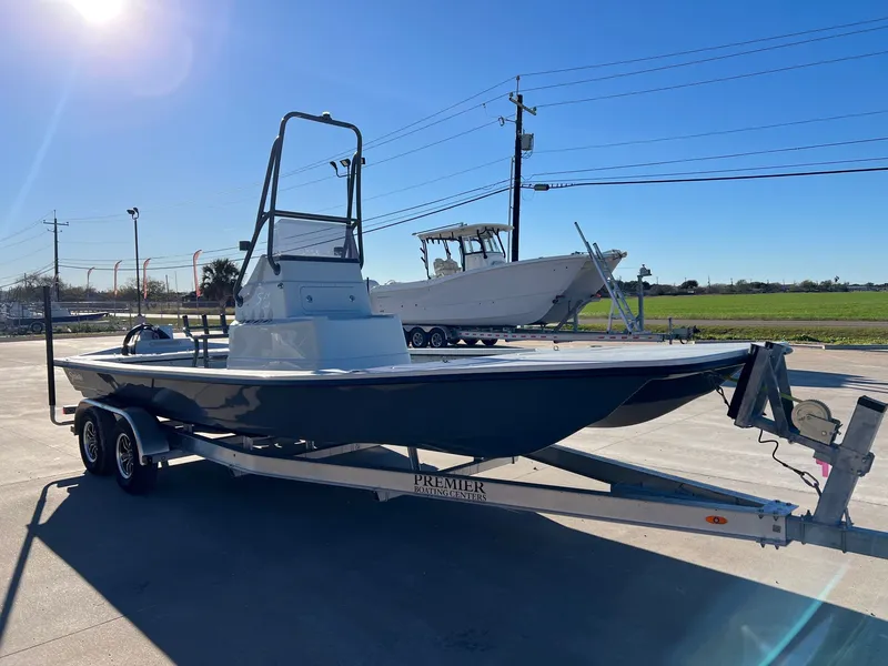 Slide: The Image of Shoalwater 23' Catamaran 2026 on trailer under sunny sky. - 6