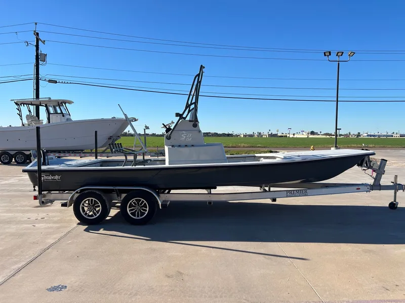 Slide: The Image of 2026 Shoalwater 23' Catamaran on trailer outdoors. - 7
