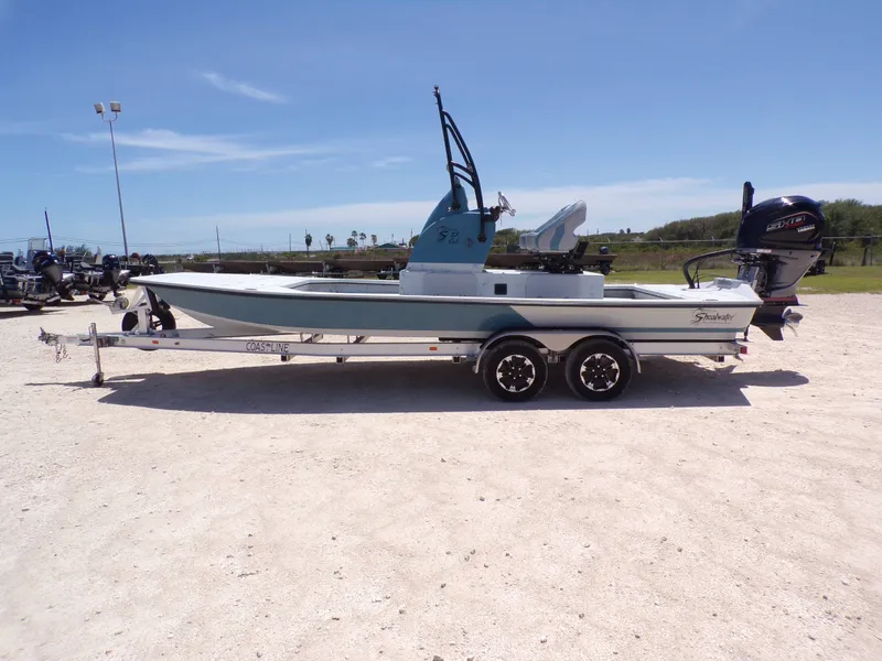 The Image of 2025 Shoalwater 23' Catamaran on trailer outdoors. - 1