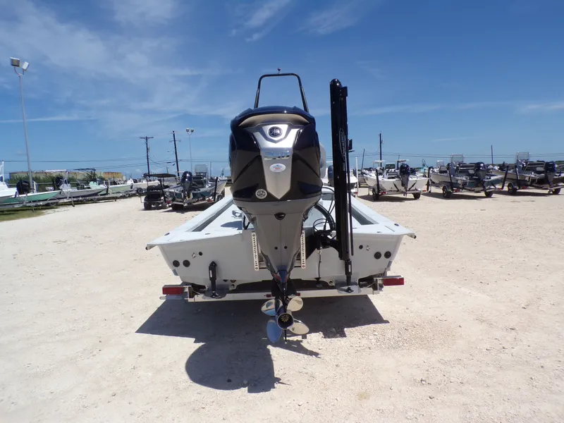 Slide: The Image of Rear view of a 2025 Shoalwater 23' Catamaran on a lot. - 10
